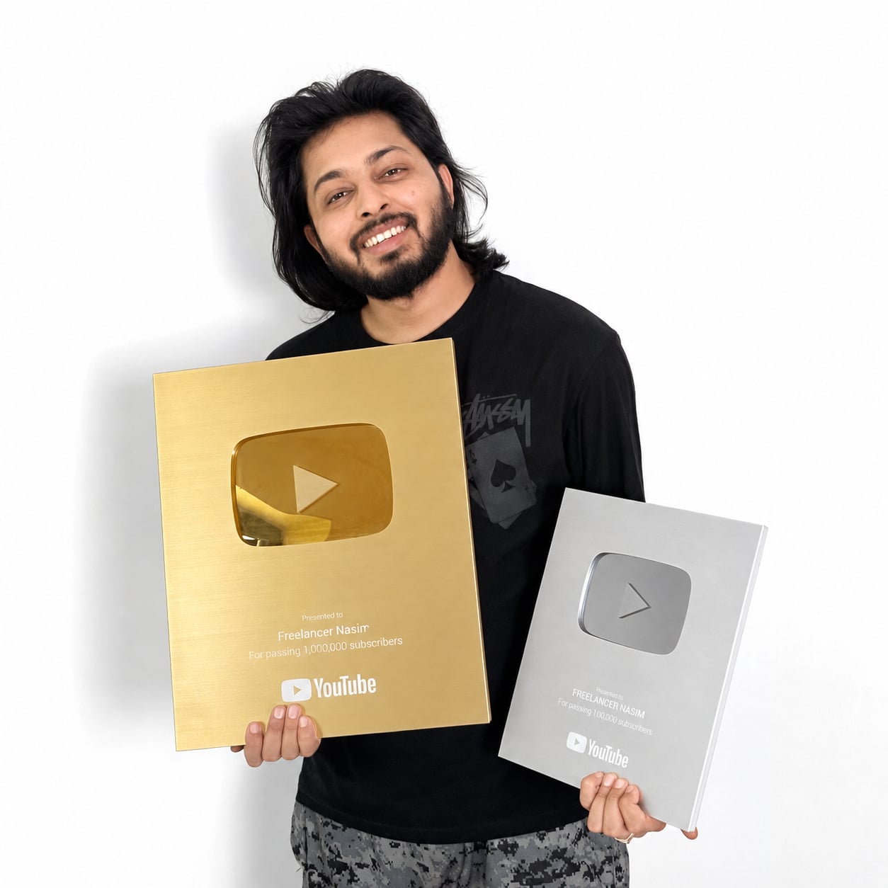 Md Nasim holding YouTube Silver and Gold Play Buttons — 100K and 1M subscriber awards for the Freelancer Nasim channel